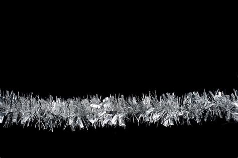 Free Stock Photo 4707 christmas tinsel on black | freeimageslive