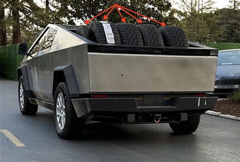 Tesla Cybertruck alpha prototype shows off its bed's capacity by carrying multiple off-road tires