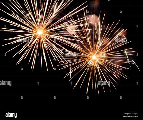 Festive celebration firework lights in the dark night sky Stock Photo - Alamy
