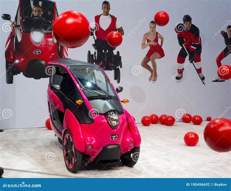 Toyota Showroom with I-Road Concept Car in Composition with Red Balls ...