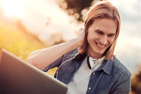 Premium Photo | Young man using laptop outdoors