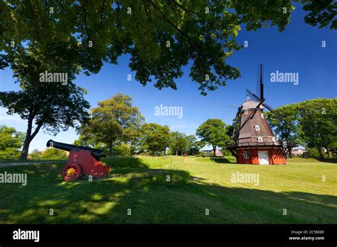 Windmill and cannon inside the Kastellet fortress Stock Photo - Alamy