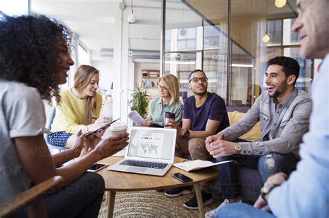 Happy business people discussing in meeting at office stock photo