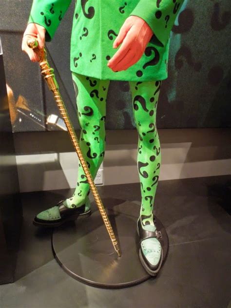 The Riddler and Two-Face villain costumes from Batman Forever on display...