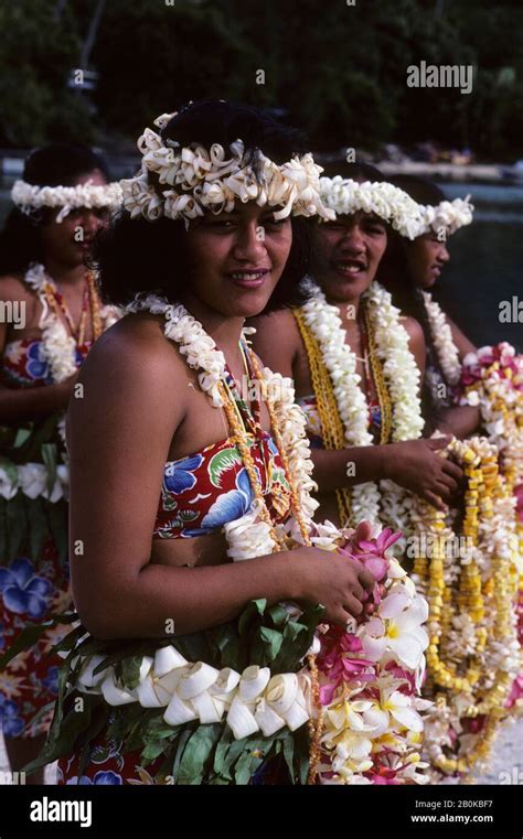 FRENCH POLYNESIA,TUAMOTUS, MANGAREVA IS.(ILES GAMBIER), RIKITEA GIRLS W/FLOWER LEIS Stock Photo ...