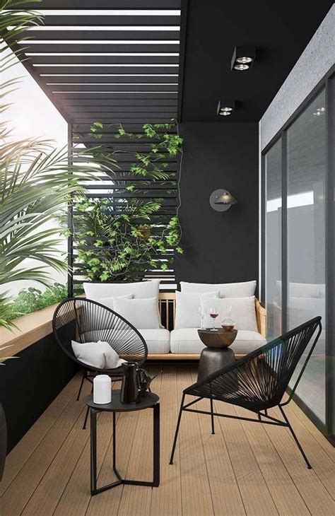 an outdoor living area with furniture and plants