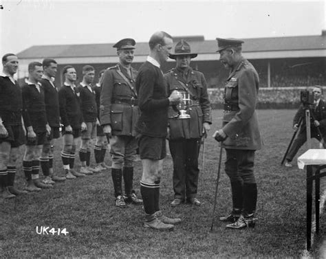File:King George V presents a cup to the captain of the winning New Zealand Services Rugby Team ...