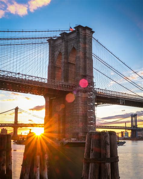 Sunrise First light in Brooklyn Bridge New York with lens flare and ...