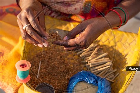 Image of Indian Rural Woman Making Beedi for her livelihood in Telangana Villages-FR017554-Picxy