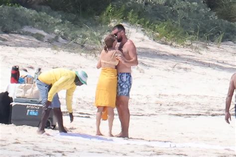 Taylor Swift Was Photographed Kissing Travis Kelce in a Yellow Bikini on Vacation