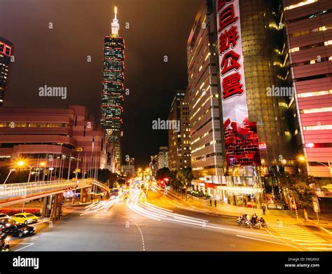 Taipei, Taiwan - night view of busy street and 101 tower Stock Photo ...