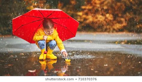 Children Splashing Water in Rain Images, Stock Photos & Vectors ...