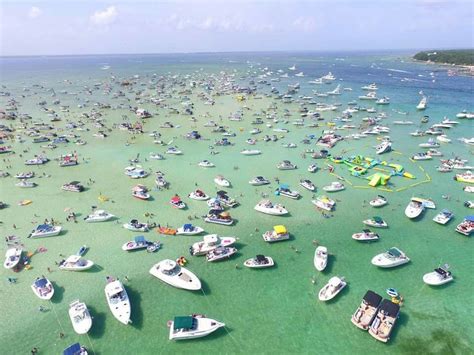 an aerial view of boats in the water