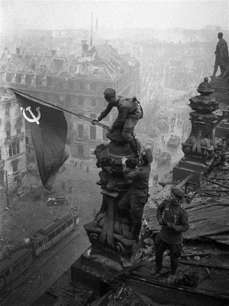 Berlin 1945 Berlin 1945. One of the most famous photos from WW2. 3 soldiers raising the Soviet ...