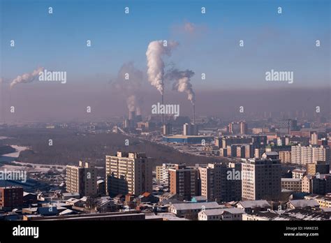 Skyline of Ulaanbaatar, Mongolia, showing the air pollution caused by 4 coal-fired power plants ...