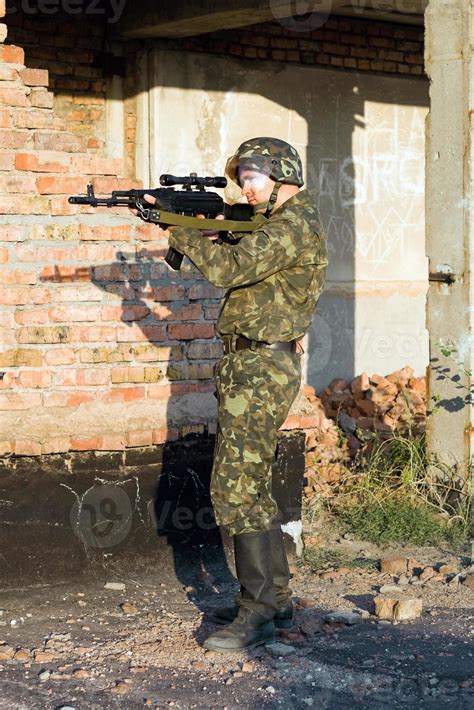 Army soldier with machine gun 18946864 Stock Photo at Vecteezy