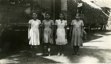 Four young Filipino women stand in their village, Philippines | The Digital Collections of the ...