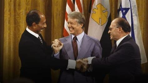 The historic photograph shown above is of former President Jimmy Carter, ushering a peace treaty ...