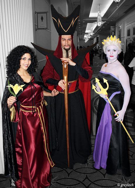 three people dressed in costumes standing next to each other