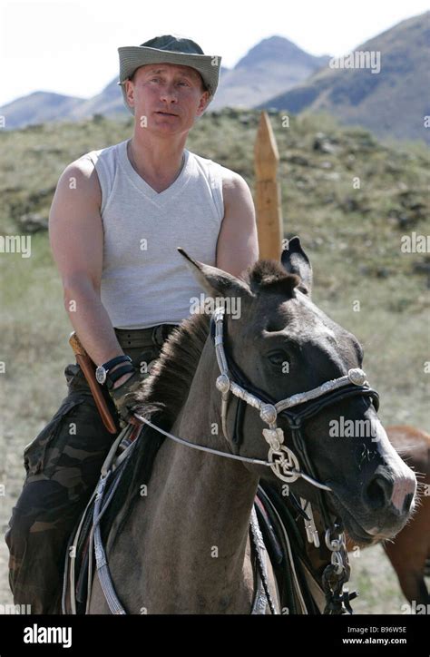 Russian President Vladimir Putin riding the horse at the spurs of the ...