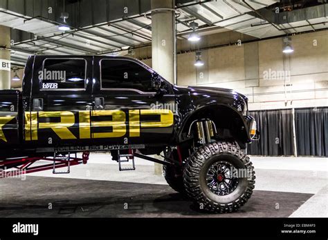 A large lifted custom Ford Truck in the Aftermarket manufacturers display hall at the 2014 Los ...