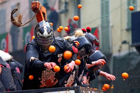 Giant food fight as thousands throw fruit in medieval Battle of the Oranges