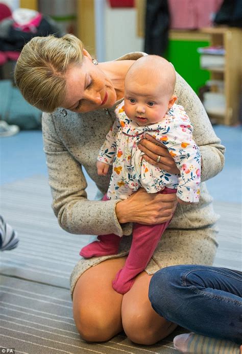 Sophie Wessex cuddles an adorable baby during a music lesson at a London nursery | Daily Mail Online