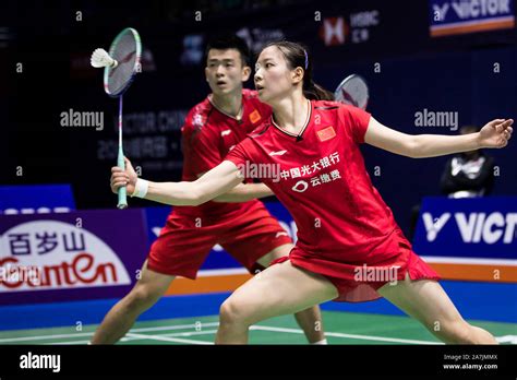 Chinese professional badminton players Zheng Siwei and Huang Yaqiong compete against Japanese ...