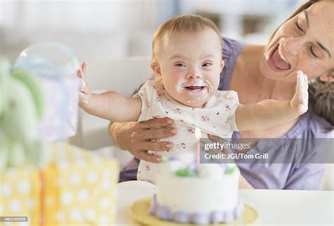 Caucasian Mother And Baby Girl With Down Syndrome Celebrating Birthday ...