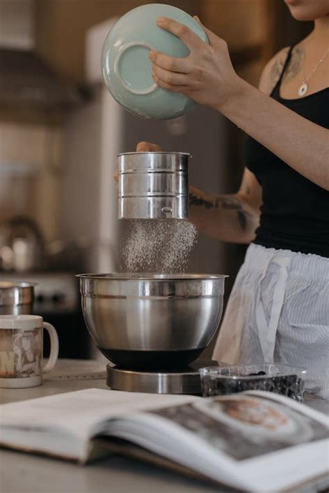 A Person Sifting Flour · Free Stock Photo