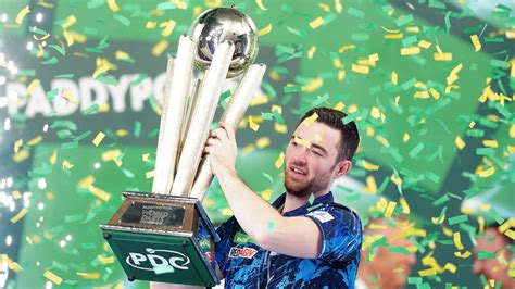 Luke Humphries wins first World Darts Championship after reeling in ...