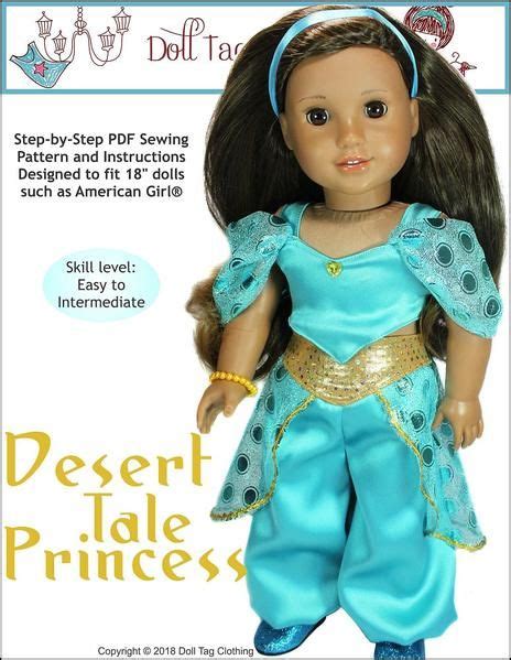 the doll is wearing a blue outfit and headband