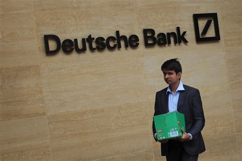 Tearful Deutsche Bank staff clear their desks as company cuts 18,000 ...