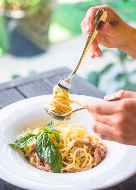 Free Photo | Close-up of a person holding appetizing spaghetti rolled ...