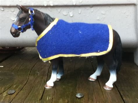 This is a Schleich horse with a halter and blanket that I made | Horse riding gear, Diy horse ...