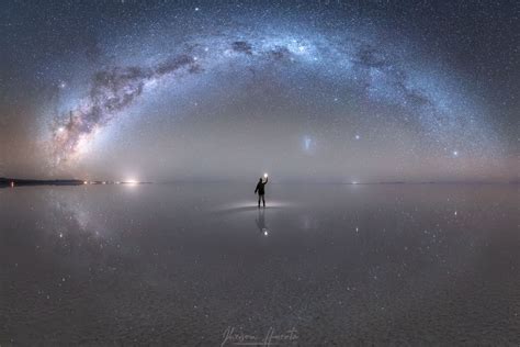 The Milky Way above the Salar de Uyuni salt flat in Bolivia. After it rains, the thin layer of ...