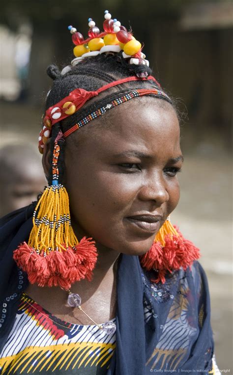 Mali, Gao. A Songhay woman at Gao market with an elaborate coiffure typical of her tribe ...