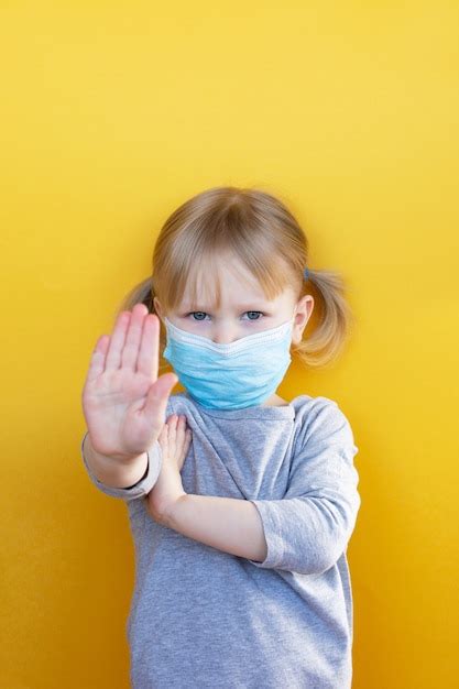 Premium Photo | Little caucasian girl wearing mask against coronavirus covid-19