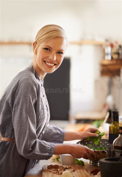 The always Cheerful Chef. Portrait of an Attractive Young Woman Preparing Food in Her Rustic ...