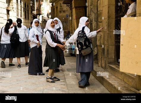 Egyptian school girls wearing school uniform in one of Cairo's old ...