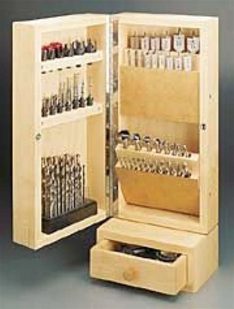 an open cabinet with many different tools in it