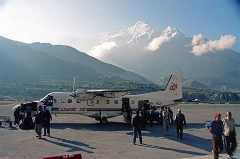 10 Deplaning At Jomsom Airport With Nilgiri North Behind