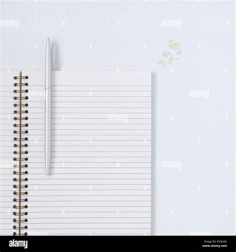 Spiral notebook with pen Stock Photo - Alamy