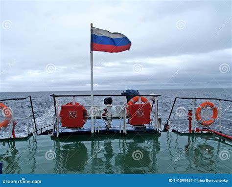 KARELIA, RUSSIA. the Russian Flag Flutters Aft the Ship Floating Across ...