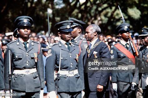 Zimbabwean president Canaan Banana reviews troops during a military ...