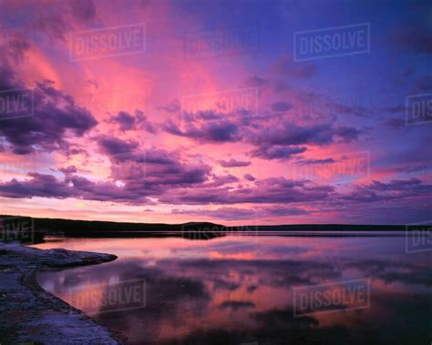 Yellowstone National Park, Wyoming. USA. Cumulus & cirrus clouds reflected in Yellowstone Lake ...