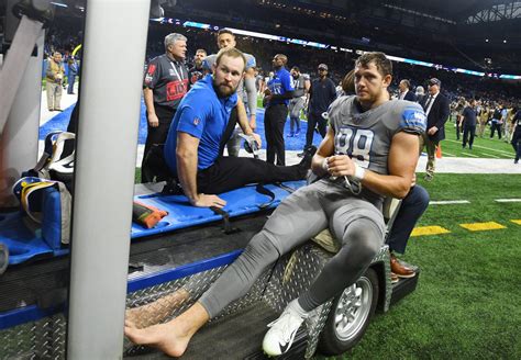 Detroit Lions' T.J. Hockenson in boot after suffering late leg injury