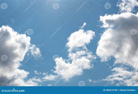 Bright Blue Sky with Fluffy White Clouds on a Sunny Day. Stock Photo - Image of open, beautiful ...