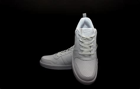 Free stock photo of black background, nike, shoes