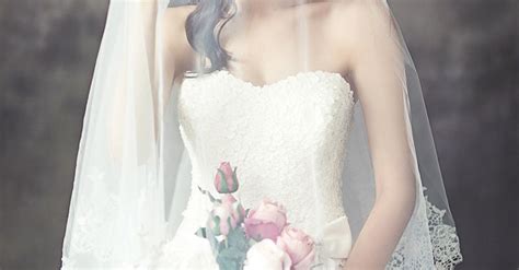 Woman in White Strapless Sweetheart Wedding Dress With Rose Bouquet Covered in White Veil · Free ...
